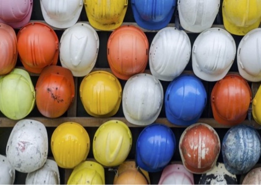 A collection of different coloured hard hats